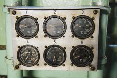 a dashboard with many analog temperature
gauges